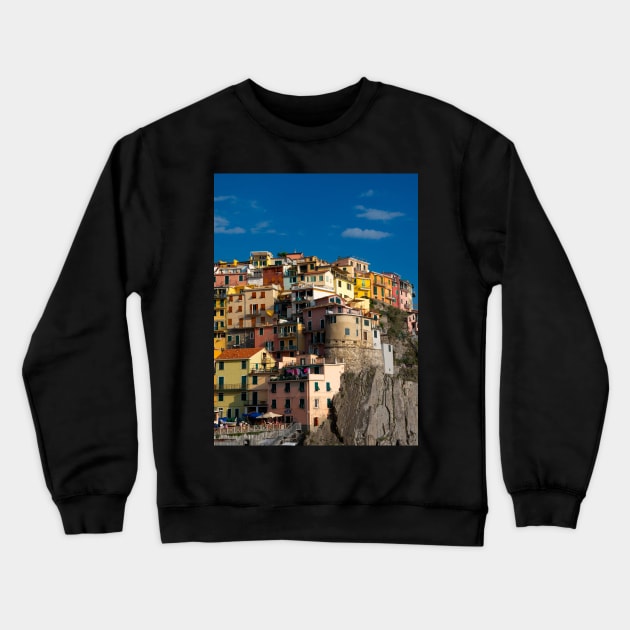 View on the cliff town of Manarola, one of the colorful Cinque Terre on the Italian west coast Crewneck Sweatshirt by Dolfilms